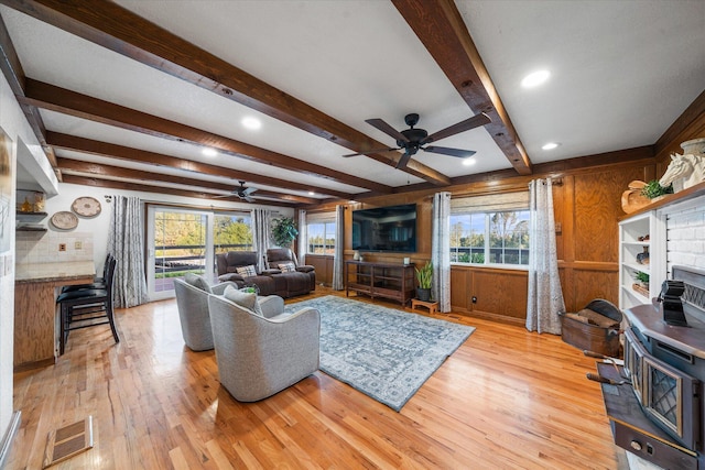 19396 Natalie Way, Redding, CA 96003 - living area with ceiling fan, light wood-style flooring, wooden walls, plenty of natural light, and beamed ceiling