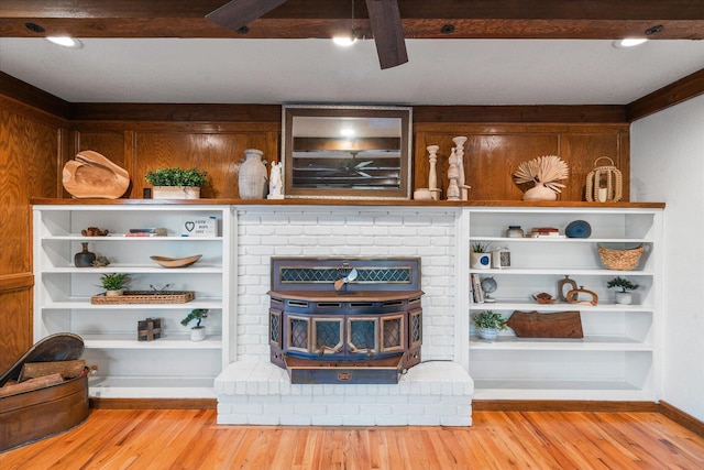 19396 Natalie Way, Redding, CA 96003 - living area with wood finished floors, a ceiling fan, a wood stove, and beamed ceiling
