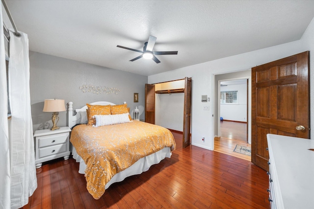 19396 Natalie Way, Redding, CA 96003 - bedroom featuring a closet, dark wood finished floors, ceiling fan, and a textured ceiling