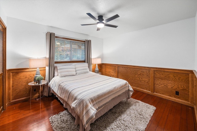 19396 Natalie Way, Redding, CA 96003 - bedroom with wainscoting, wood-type flooring, a ceiling fan, and a closet