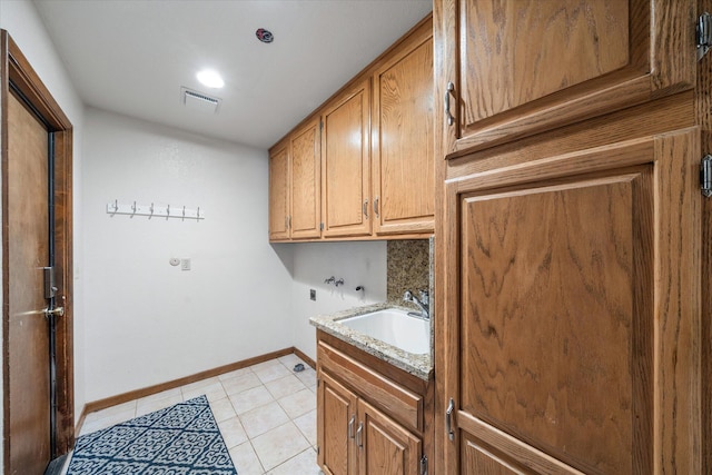 19396 Natalie Way, Redding, CA 96003 - washroom featuring hookup for a washing machine, cabinet space, and light tile patterned floors