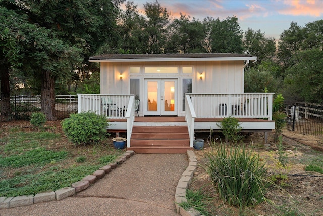 19396 Natalie Way, Redding, CA 96003 - view of front facade featuring a wooden deck and view of wooded area