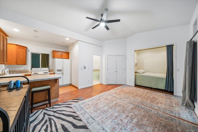 19396 Natalie Way, Redding, CA 96003 - kitchen with white appliances, tile counters, ceiling fan, recessed lighting, and light wood-style floors