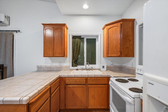 19396 Natalie Way, Redding, CA 96003 - kitchen with white range with electric stovetop, brown cabinetry, a peninsula, light countertops, and recessed lighting