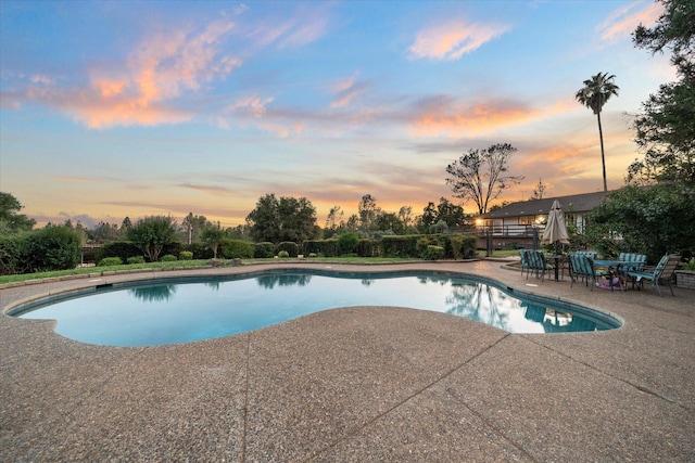 19396 Natalie Way, Redding, CA 96003 - pool at dusk with a patio area and an outdoor pool