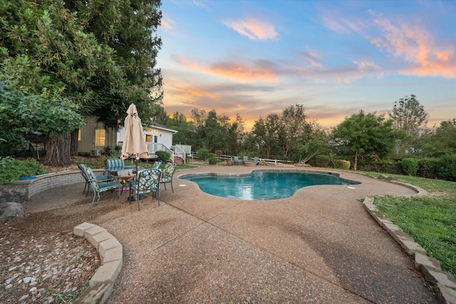 19396 Natalie Way, Redding, CA 96003 - pool at dusk with a patio area and an outdoor pool