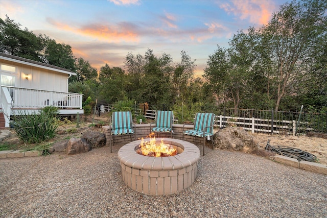 19396 Natalie Way, Redding, CA 96003 - view of patio featuring a fire pit, a wooden deck, and view of scattered trees