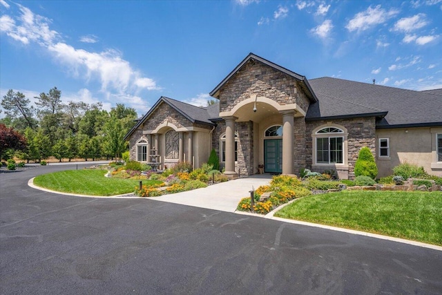 19580 Mockingbird Ln, Redding, CA 96002 - french provincial home featuring stone siding, a front lawn, and stucco siding