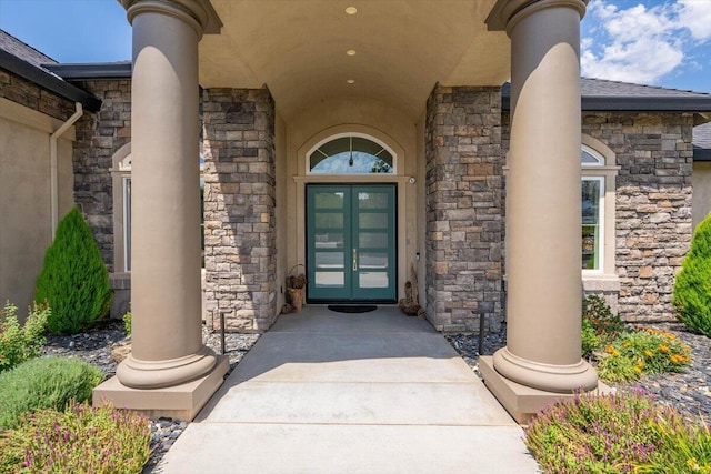 19580 Mockingbird Ln, Redding, CA 96002 - view of exterior entry with stone siding, french doors, and stucco siding