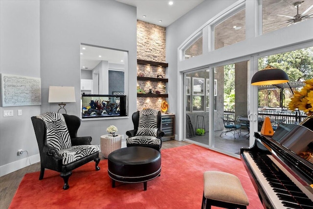 19580 Mockingbird Ln, Redding, CA 96002 - living area featuring a towering ceiling, wood finished floors, healthy amount of natural light, a ceiling fan, and recessed lighting