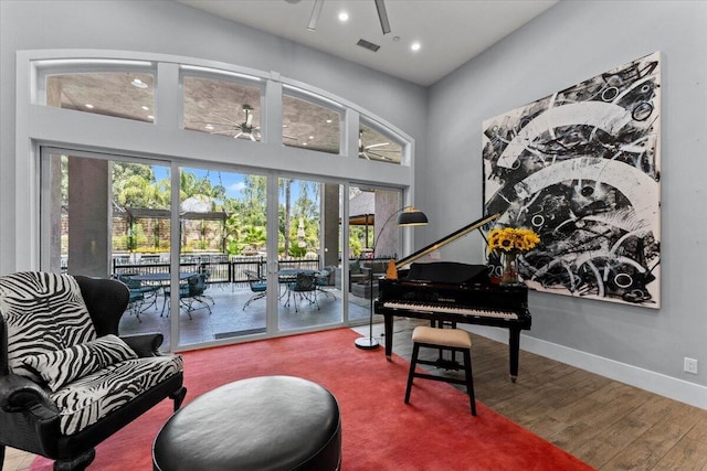 19580 Mockingbird Ln, Redding, CA 96002 - sitting room featuring a ceiling fan, wood finished floors, recessed lighting, and a high ceiling