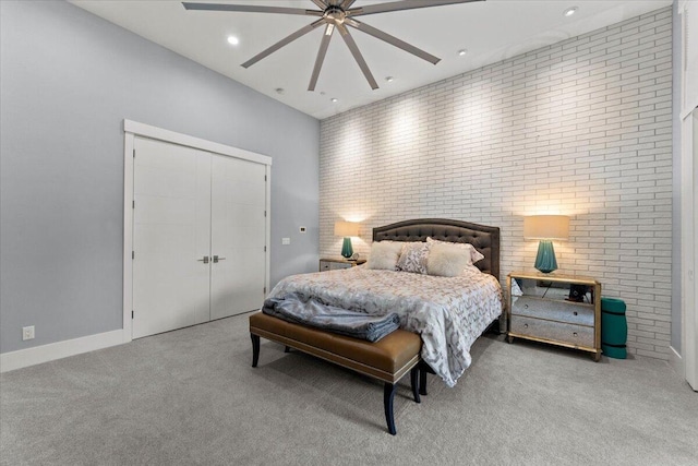 19580 Mockingbird Ln, Redding, CA 96002 - bedroom featuring carpet floors, recessed lighting, brick wall, a closet, and ceiling fan