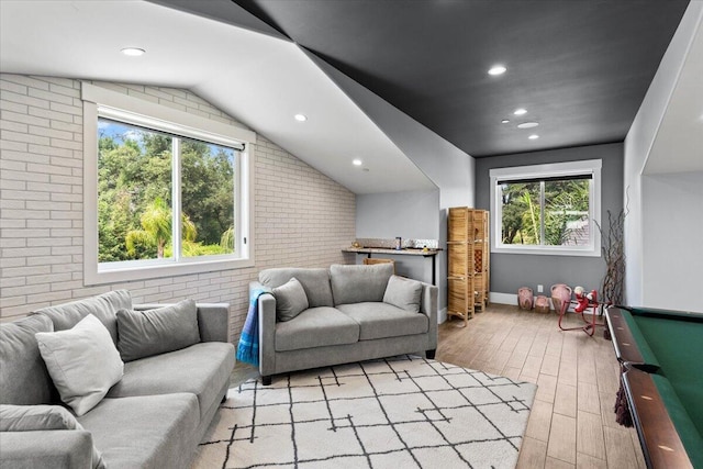 19580 Mockingbird Ln, Redding, CA 96002 - living area featuring brick wall, light wood-style floors, healthy amount of natural light, recessed lighting, and lofted ceiling