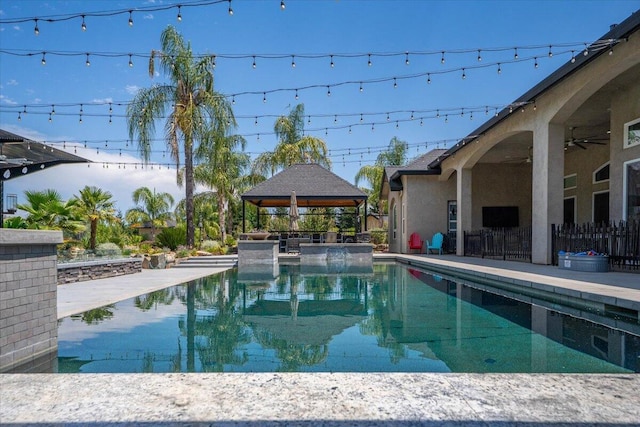 19580 Mockingbird Ln, Redding, CA 96002 - swimming pool featuring a gazebo and a ceiling fan