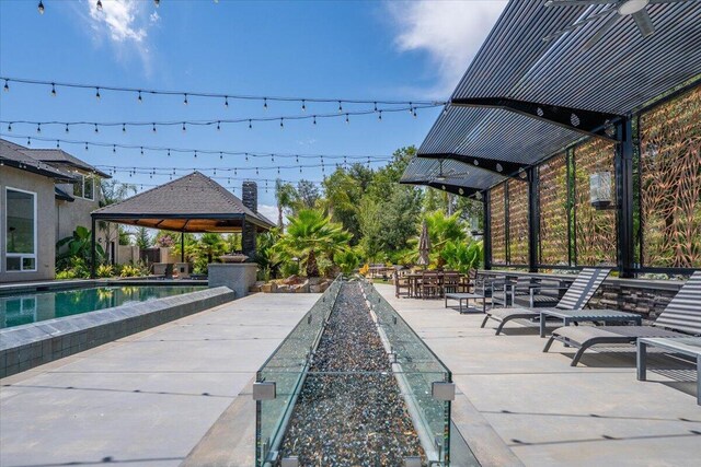 19580 Mockingbird Ln, Redding, CA 96002 - view of community featuring a gazebo, a pool, and a patio area