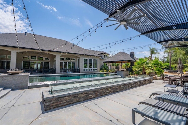 19580 Mockingbird Ln, Redding, CA 96002 - view of patio / terrace with a gazebo, a ceiling fan, and an outdoor pool