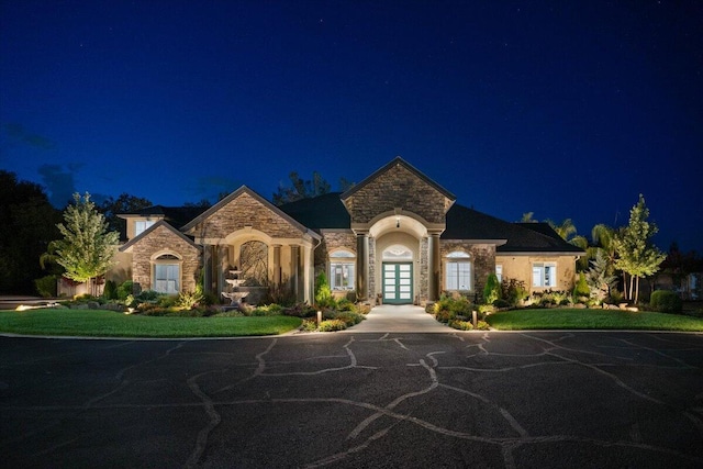 19580 Mockingbird Ln, Redding, CA 96002 - french country inspired facade with french doors and stone siding