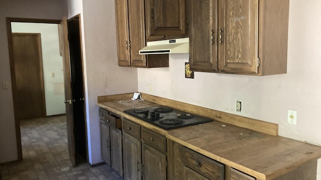 770 Day Rd, Mcarthur, CA 96056 - kitchen featuring under cabinet range hood and black electric cooktop