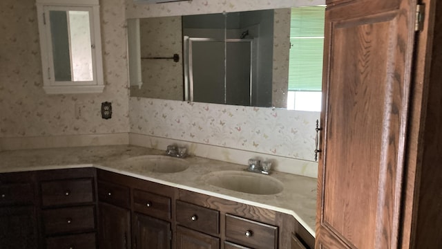 770 Day Rd, Mcarthur, CA 96056 - full bathroom featuring double vanity, wallpapered walls, and a stall shower