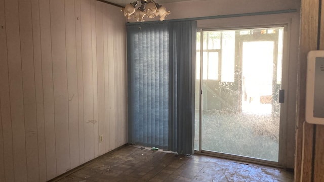 770 Day Rd, Mcarthur, CA 96056 - unfurnished dining area featuring a chandelier and wood walls