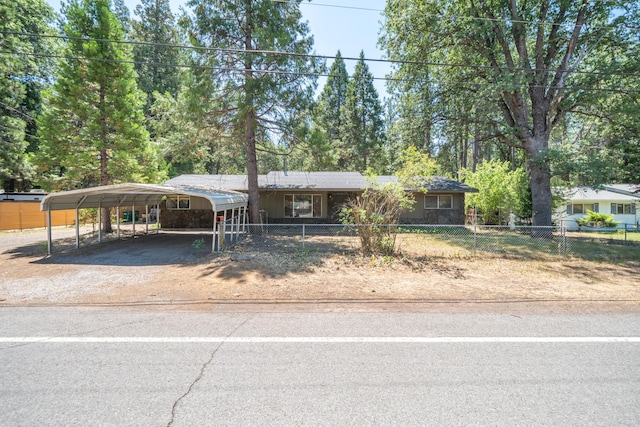 37347 Cypress Ave, Burney, CA 96013 - single story home with dirt driveway, a carport, and a fenced front yard