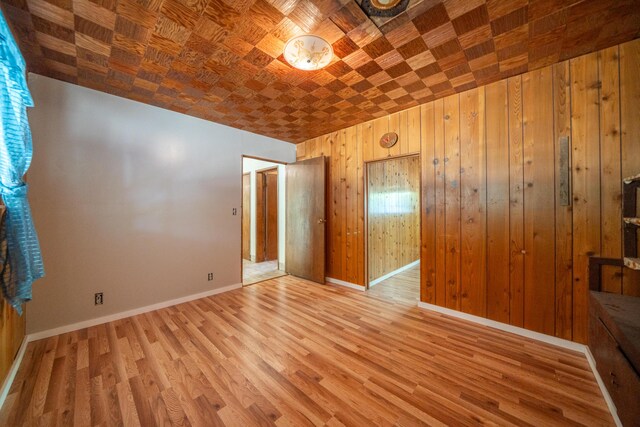 37347 Cypress Ave, Burney, CA 96013 - empty room with light wood-style floors and wood walls