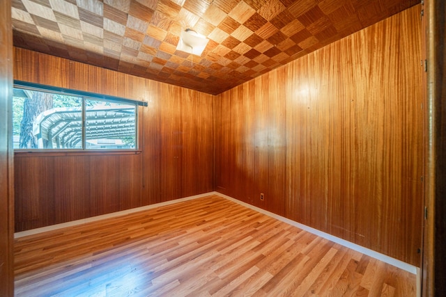 37347 Cypress Ave, Burney, CA 96013 - spare room with light wood-type flooring and wooden walls