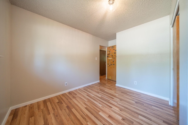 37347 Cypress Ave, Burney, CA 96013 - unfurnished room with light wood-type flooring and a textured ceiling