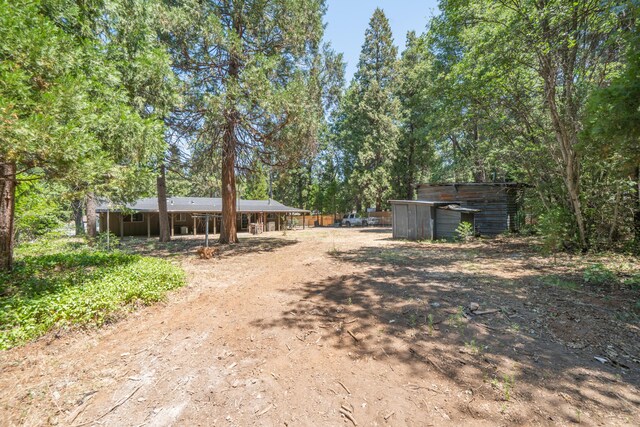 37347 Cypress Ave, Burney, CA 96013 - view of front of house with dirt driveway and an outdoor structure