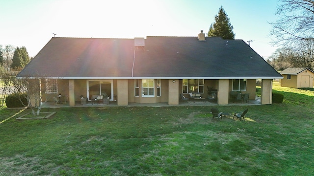 3010 Mateo Ct, Anderson, CA 96007 - rear view of house with a patio, a shed, stucco siding, and a yard