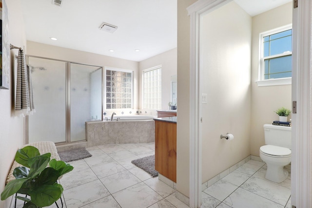 3010 Mateo Ct, Anderson, CA 96007 - full bathroom featuring marble look tiles, a garden tub, a shower stall, healthy amount of natural light, and recessed lighting