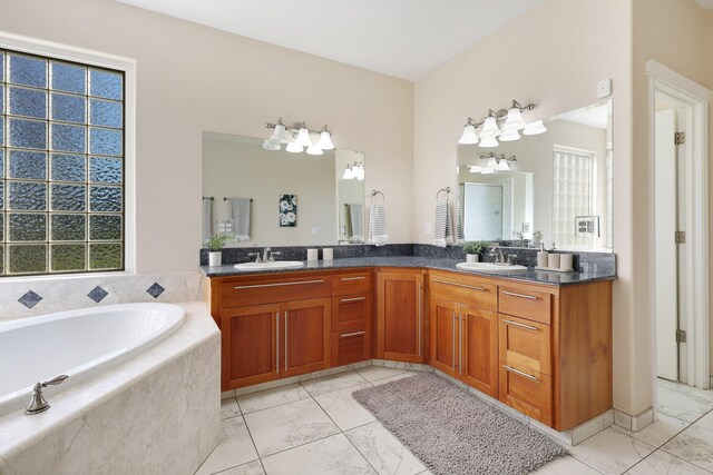 3010 Mateo Ct, Anderson, CA 96007 - bathroom with double vanity, a garden tub, and marble look tiles