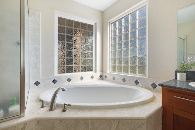 3010 Mateo Ct, Anderson, CA 96007 - bathroom featuring vanity, a garden tub, and plenty of natural light