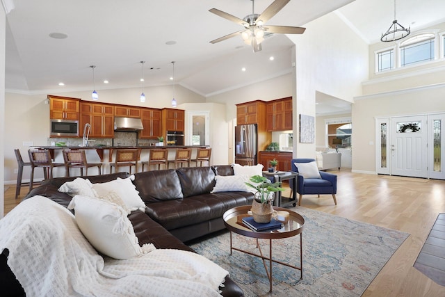3010 Mateo Ct, Anderson, CA 96007 - living room featuring high vaulted ceiling, a ceiling fan, light wood finished floors, crown molding, and recessed lighting