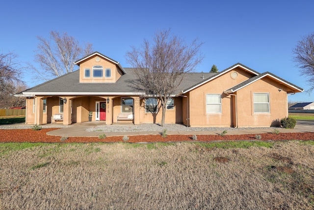 3010 Mateo Ct, Anderson, CA 96007 - view of front facade featuring stucco siding, a porch, and a front yard
