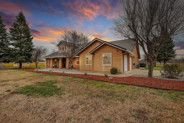 3010 Mateo Ct, Anderson, CA 96007 - view of front facade featuring concrete driveway, an attached garage, a front yard, stucco siding, and covered porch