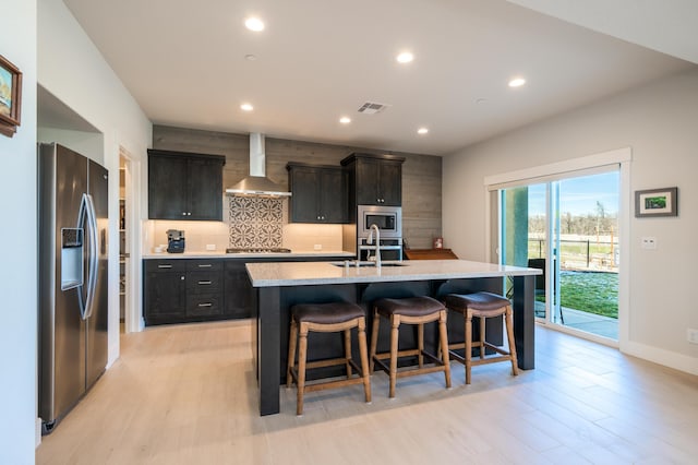 6538 Bandito Dr, Redding, CA 96003 - kitchen featuring stainless steel appliances, wall chimney exhaust hood, backsplash, light countertops, and recessed lighting