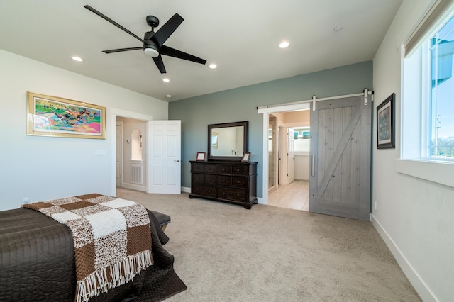 6538 Bandito Dr, Redding, CA 96003 - bedroom with a barn door, light carpet, recessed lighting, a ceiling fan, and ensuite bath