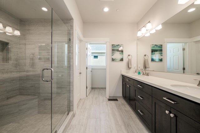 6538 Bandito Dr, Redding, CA 96003 - full bathroom with double vanity, a shower stall, and recessed lighting
