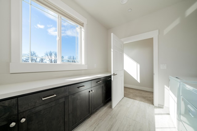 6538 Bandito Dr, Redding, CA 96003 - washroom featuring washer and dryer, plenty of natural light, and cabinet space