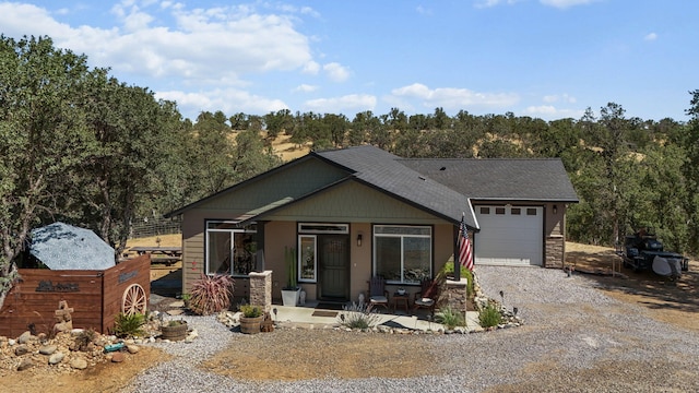 18710 Saddleback Ridge Rd, Cottonwood, CA 96022 - view of front facade featuring driveway, a garage, roof with shingles, and covered porch