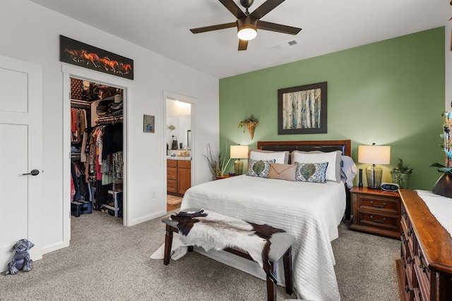 18710 Saddleback Ridge Rd, Cottonwood, CA 96022 - carpeted bedroom featuring a spacious closet, connected bathroom, and a ceiling fan