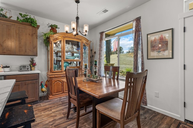 18710 Saddleback Ridge Rd, Cottonwood, CA 96022 - dining area with dark wood finished floors and a chandelier
