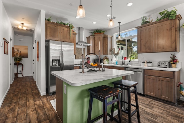 18710 Saddleback Ridge Rd, Cottonwood, CA 96022 - kitchen with wall chimney exhaust hood, stainless steel appliances, light countertops, dark wood finished floors, and recessed lighting
