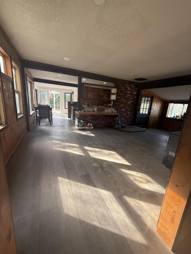3400 Beacon Dr, Anderson, CA 96007 - hall with a textured ceiling, wood finished floors, plenty of natural light, and wood walls