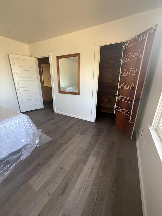 3400 Beacon Dr, Anderson, CA 96007 - unfurnished bedroom featuring dark wood-type flooring and baseboards