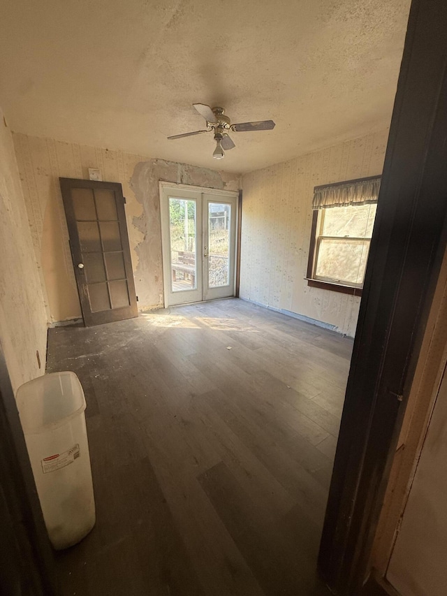 3400 Beacon Dr, Anderson, CA 96007 - empty room featuring ceiling fan, wood finished floors, a textured ceiling, and french doors
