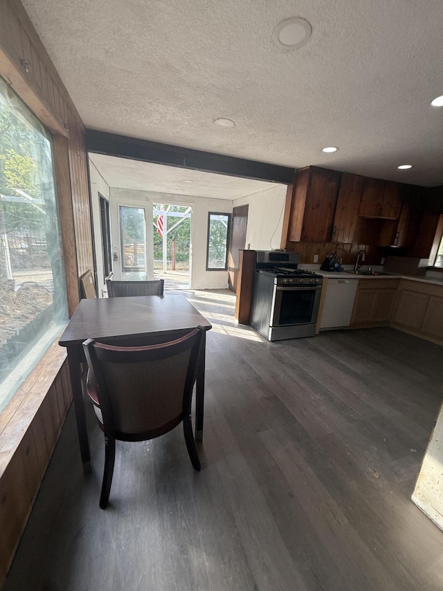 3400 Beacon Dr, Anderson, CA 96007 - kitchen with stainless steel gas range oven, a textured ceiling, dark wood finished floors, dishwasher, and recessed lighting