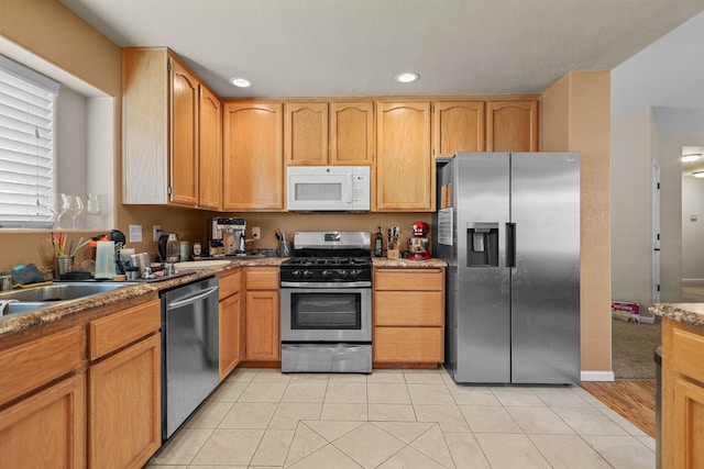 1870 Trumpet Dr, Redding, CA 96003 - kitchen with appliances with stainless steel finishes, recessed lighting, and light tile patterned floors