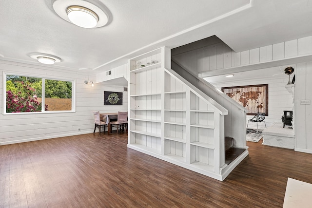 1575 Fig Ave, Redding, CA 96001 - living room with stairway, wood finished floors, wood walls, and a textured ceiling